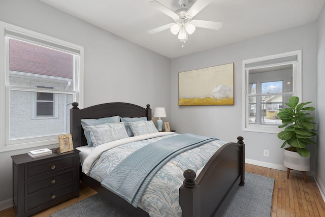 bedroom featuring hardwood / wood-style floors and ceiling fan