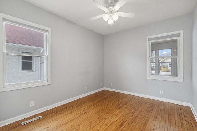 unfurnished room with wood-type flooring and ceiling fan