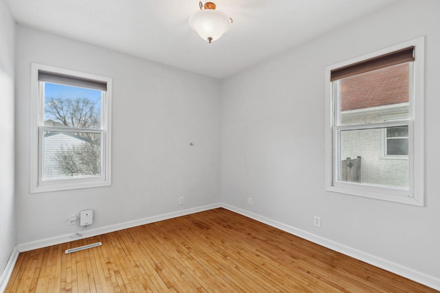 unfurnished room featuring wood-type flooring