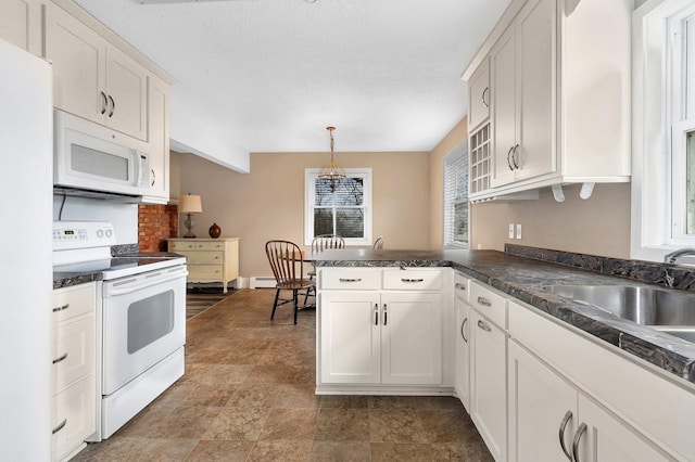 kitchen with pendant lighting, white appliances, white cabinets, sink, and kitchen peninsula