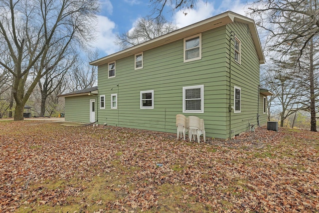 rear view of house with cooling unit