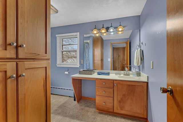 bathroom featuring vanity and a baseboard radiator