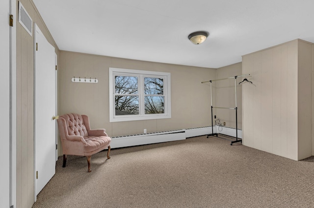 sitting room with carpet flooring and a baseboard radiator