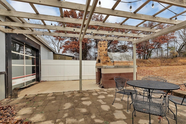 view of patio / terrace with a pergola and a fireplace