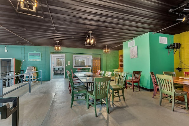 dining space with concrete flooring