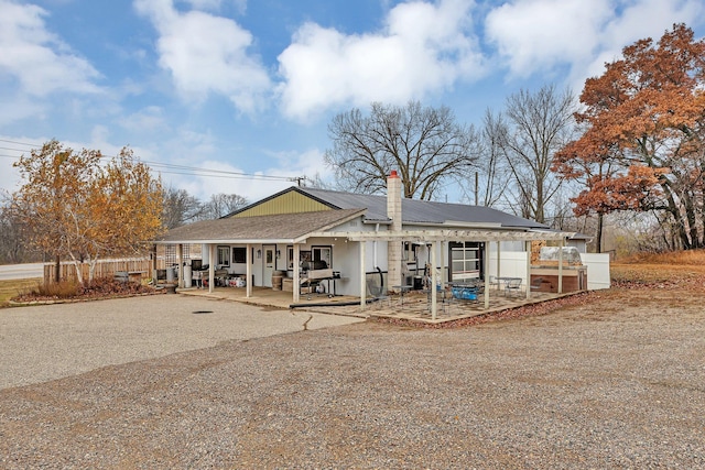 view of front of property featuring a patio