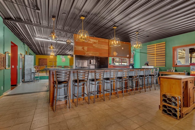 kitchen featuring pendant lighting and light tile patterned floors