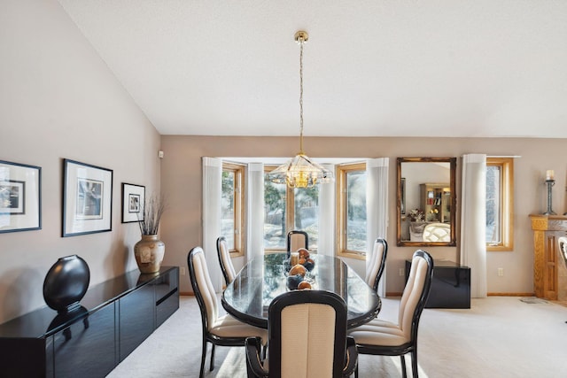 dining space featuring light colored carpet, lofted ceiling, a textured ceiling, and a chandelier