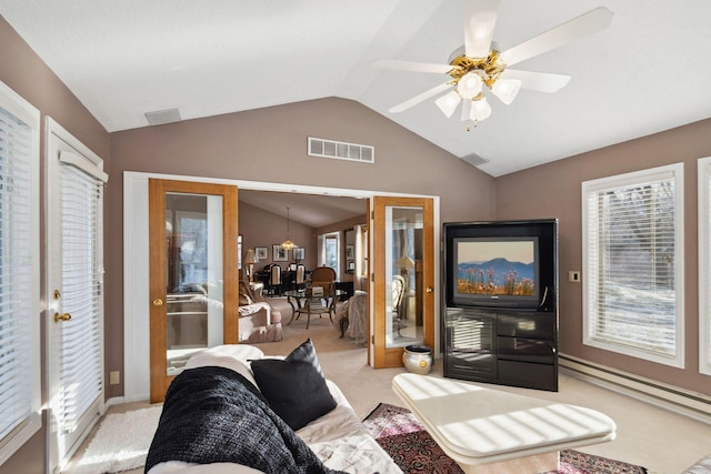 living room featuring light carpet, french doors, ceiling fan, and vaulted ceiling