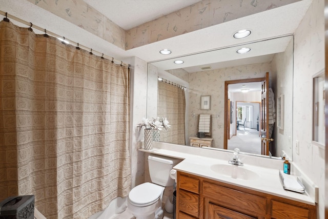 full bathroom featuring shower / bath combination with curtain, vanity, and toilet