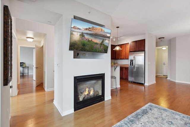 living room with light hardwood / wood-style flooring