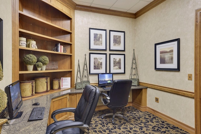 office area with carpet, a drop ceiling, and ornamental molding