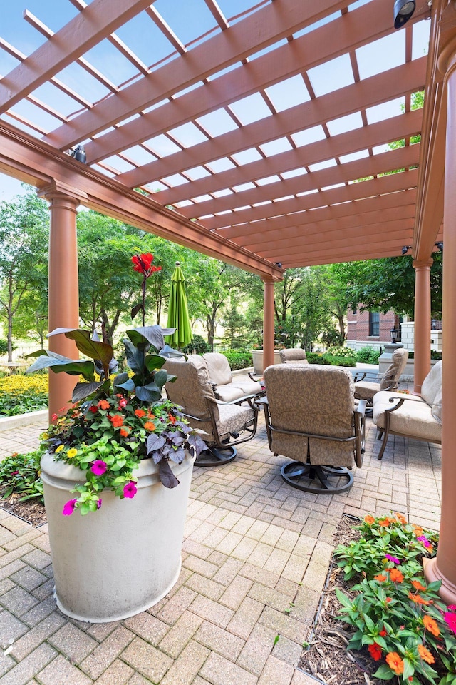 view of patio with an outdoor living space and a pergola