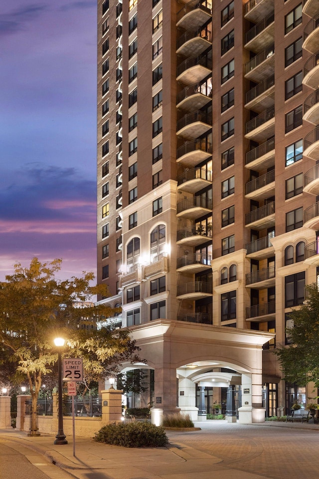 view of outdoor building at dusk