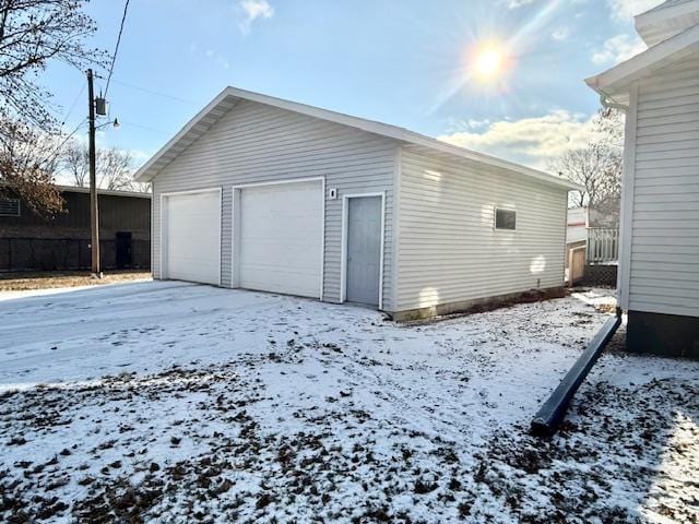 view of snow covered garage