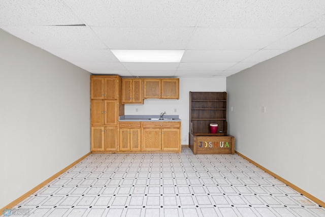 kitchen with a drop ceiling and sink