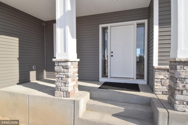 doorway to property with a porch