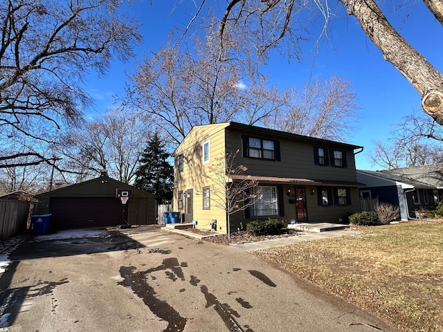 front facade with a garage and an outdoor structure