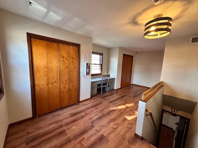 interior space with hardwood / wood-style flooring