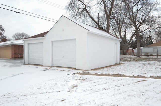 view of snow covered garage