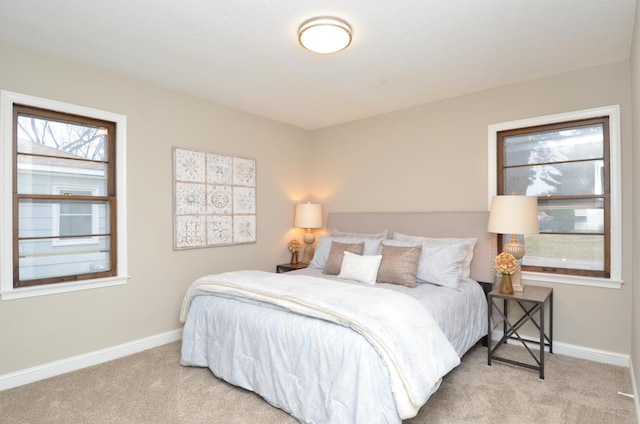 bedroom featuring light carpet