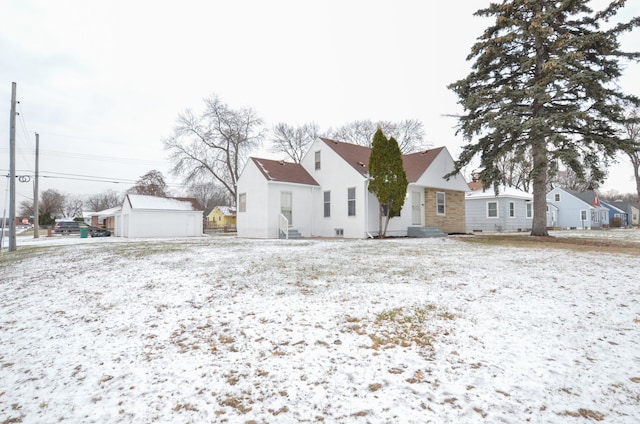 view of snow covered house