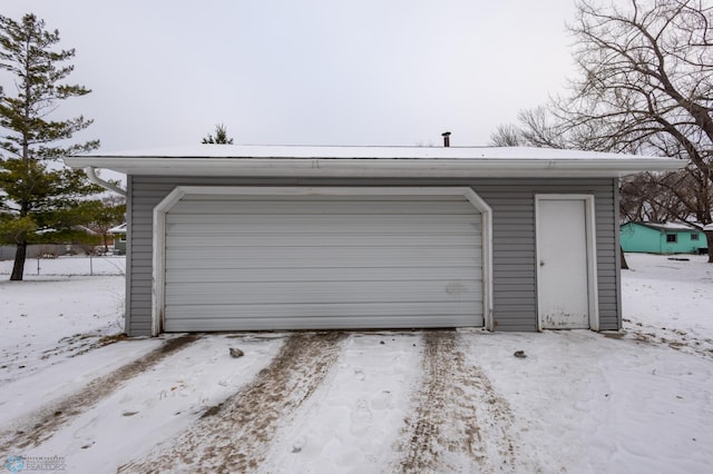 view of snow covered garage