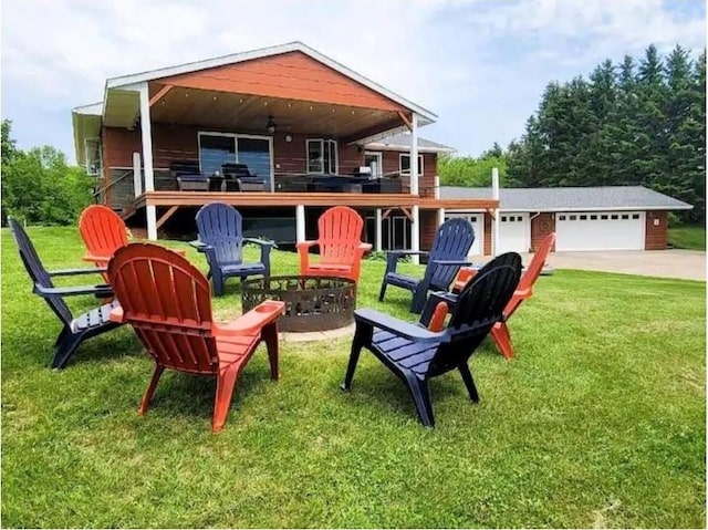 view of playground with a lawn and a fire pit