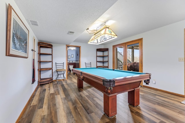 recreation room featuring a textured ceiling, dark hardwood / wood-style flooring, french doors, and pool table