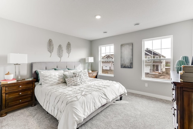 bedroom with light colored carpet