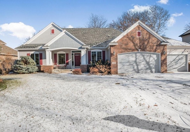 view of front of home with a porch and a garage