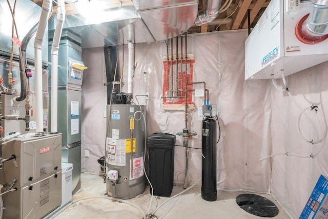 utility room featuring gas water heater and heating unit