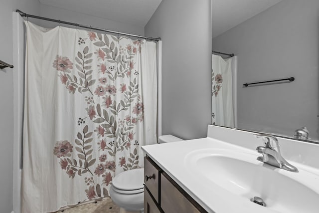 bathroom with vanity, a shower with curtain, and toilet
