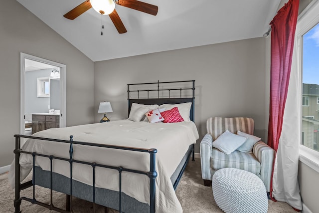 bedroom with multiple windows, carpet, and vaulted ceiling