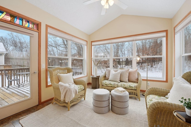 sunroom featuring lofted ceiling, a healthy amount of sunlight, and ceiling fan