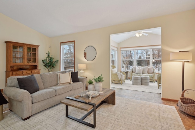 living room featuring lofted ceiling and ceiling fan