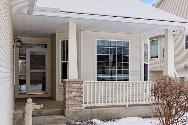 view of snow covered property entrance