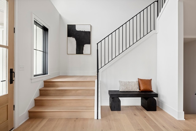 stairway featuring hardwood / wood-style floors