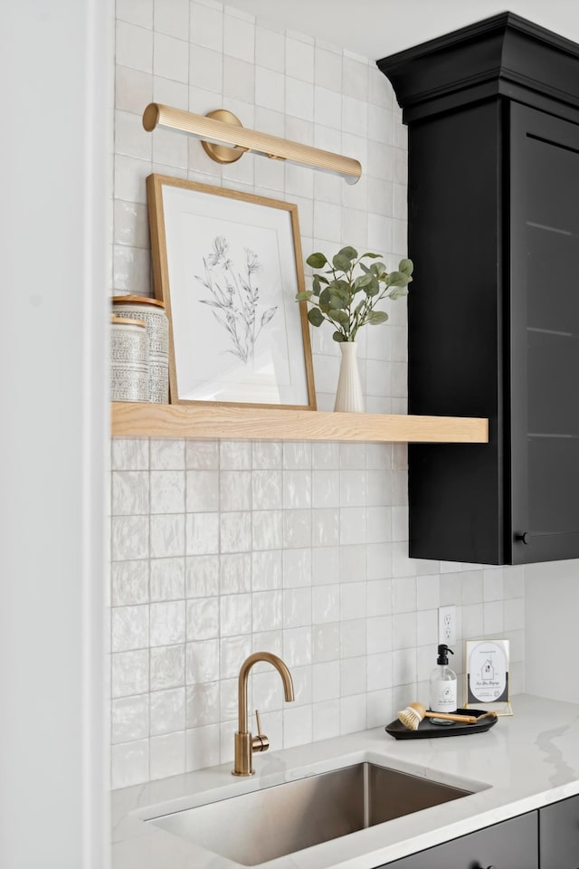 kitchen featuring tasteful backsplash and sink