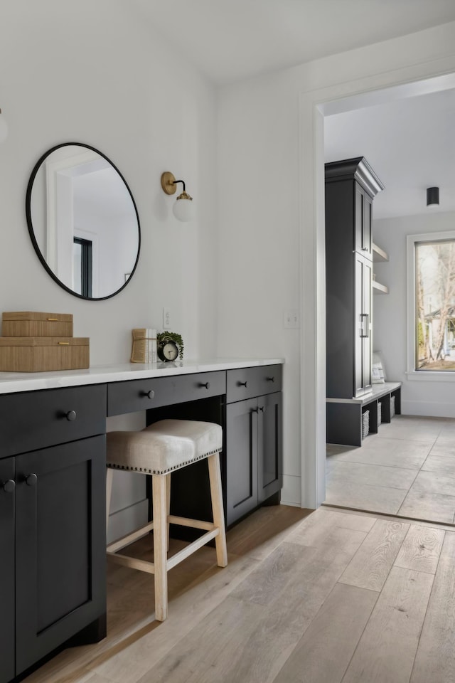 bathroom with hardwood / wood-style floors and vanity