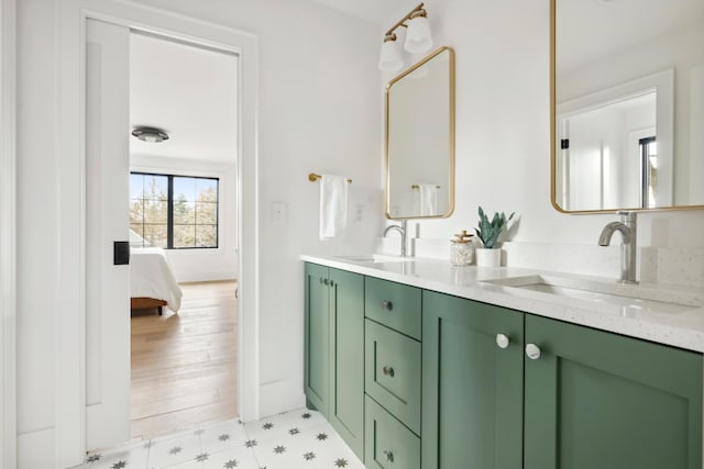 bathroom with wood-type flooring and vanity