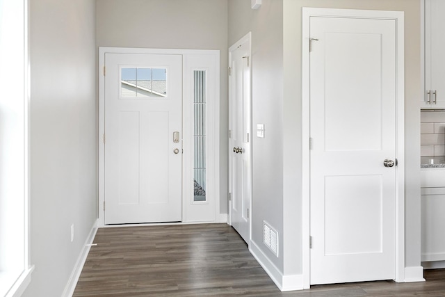 foyer with dark hardwood / wood-style floors