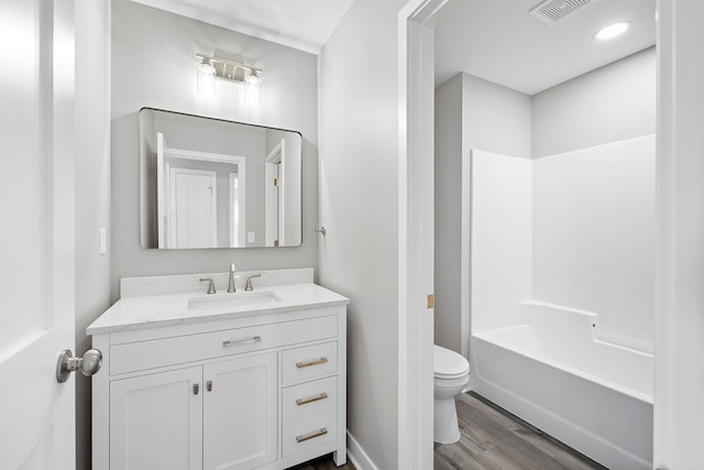 full bathroom with vanity, shower / bathtub combination, toilet, and wood-type flooring