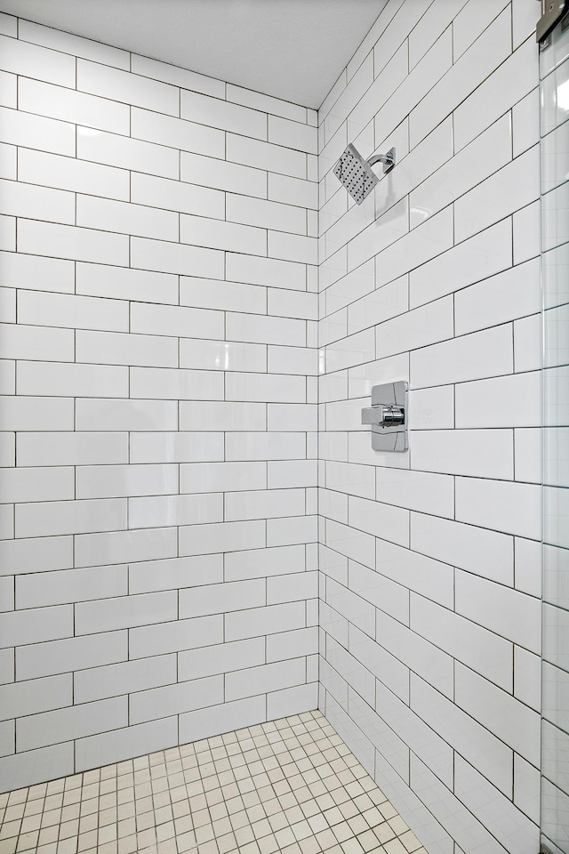 bathroom with a tile shower