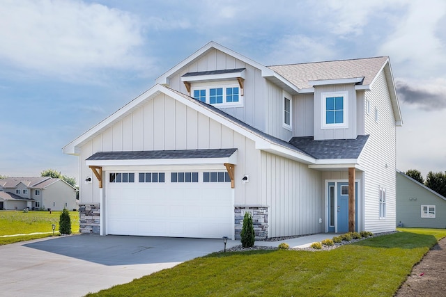 view of front of house with a front lawn and a garage