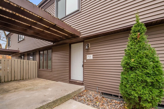 property entrance featuring a patio