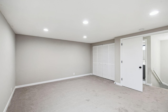 unfurnished bedroom with light colored carpet