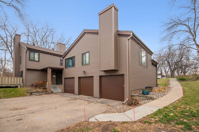 view of side of property with a garage