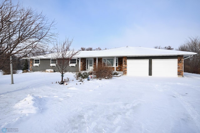 ranch-style home featuring a garage