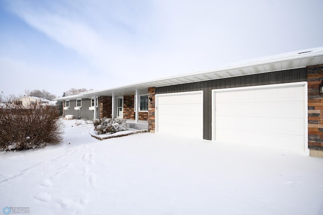 ranch-style house featuring a garage